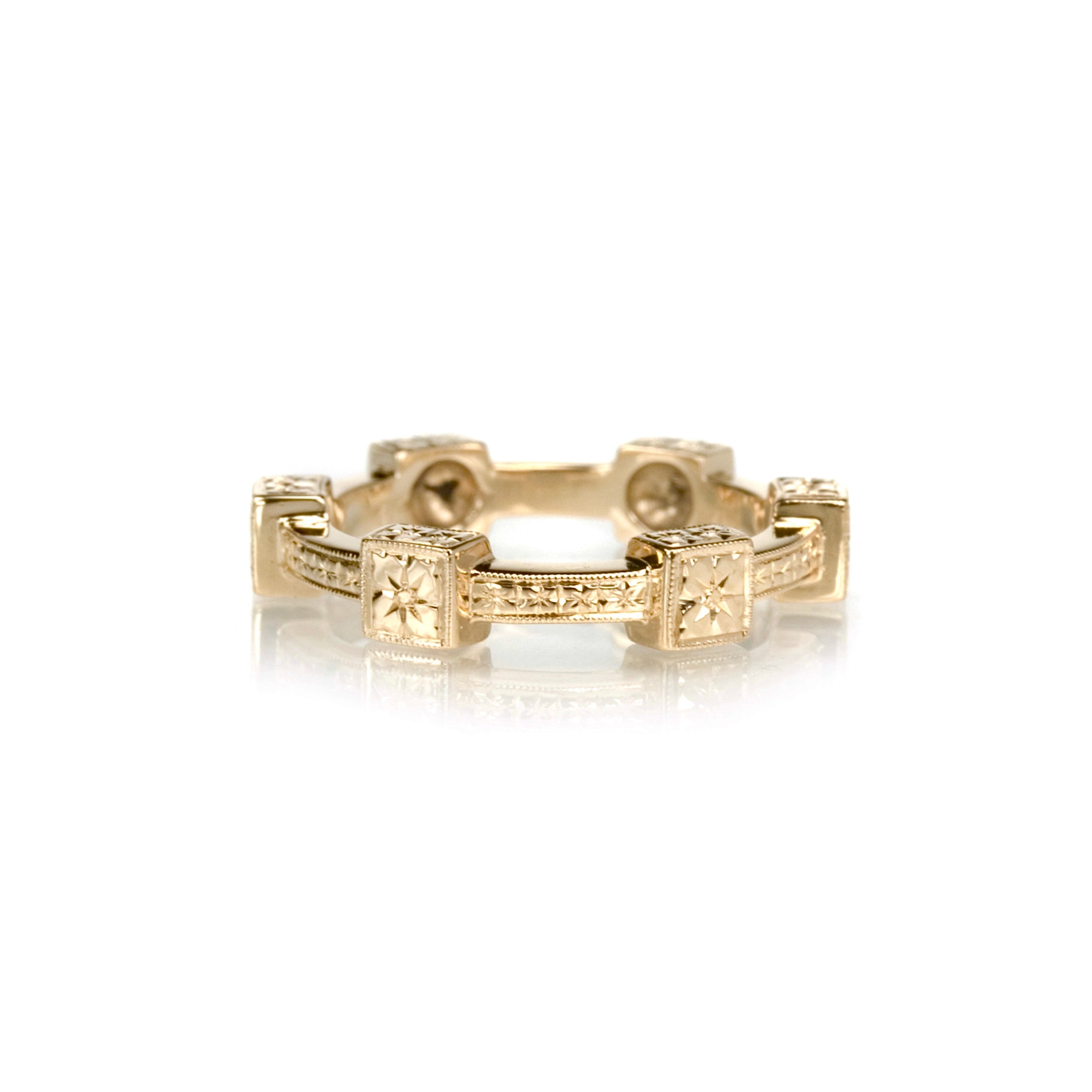 Crafted in 14KT yellow gold, this ring features orange blossom hand-engravings in square settings and on the band. 