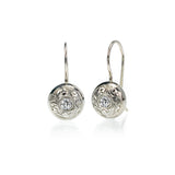 Crafted in 14KT white gold, these drop earrings feature round brilliant-cut diamonds with paisley hand-engraved halos.