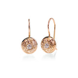 Crafted in 14KT rose gold, these drop earrings feature round brilliant-cut diamonds with paisley hand-engraved halos.