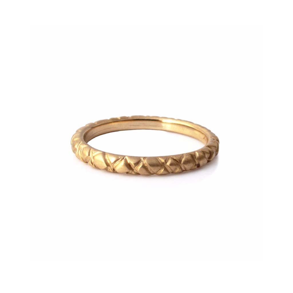 Quilted band crafted in 14KT yellow gold. 