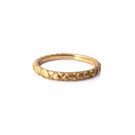Quilted band crafted in 14KT yellow gold.