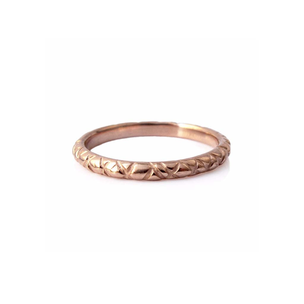 Quilted band crafted in 14KT rose gold.