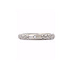 Crafted in 14KT white gold, this quilted band features a round brilliant-cut centre diamond.