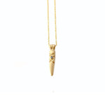 Crafted in 14KT yellow gold, this arrowhead shaped pendant features a round black diamond and simple x-design details.