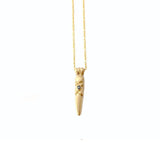 Crafted in 14KT yellow gold, this arrowhead shaped pendant features a round black diamond and simple x-design details.