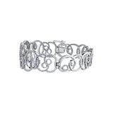 Crafted in 14KT white Certified Canadian Gold, this bracelet features a sprout-inspired swirling design set with round brilliant-cut Canadian diamonds.