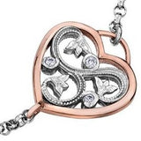 Crafted in 14KT white and rose Certified Canadian Gold, this bracelet features a rose vine design set with round brilliant-cut Canadian diamonds all enclosed in a heart shape.