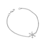 Crafted in 14KT white Canadian Certified Gold, this bracelet features a snowflake pendant with a round brilliant-cut Canadian centre diamond.