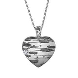 Crafted in 14KT Certified Canadian Gold, this heart shape pendant features a birch bark pattern with black rhodium details and a round brilliant-cut Canadian diamond.