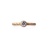 Crafted in 14KT brushed yellow gold, this ring features a bezel-set round brilliant-cut diamond on a semi-quilted band.