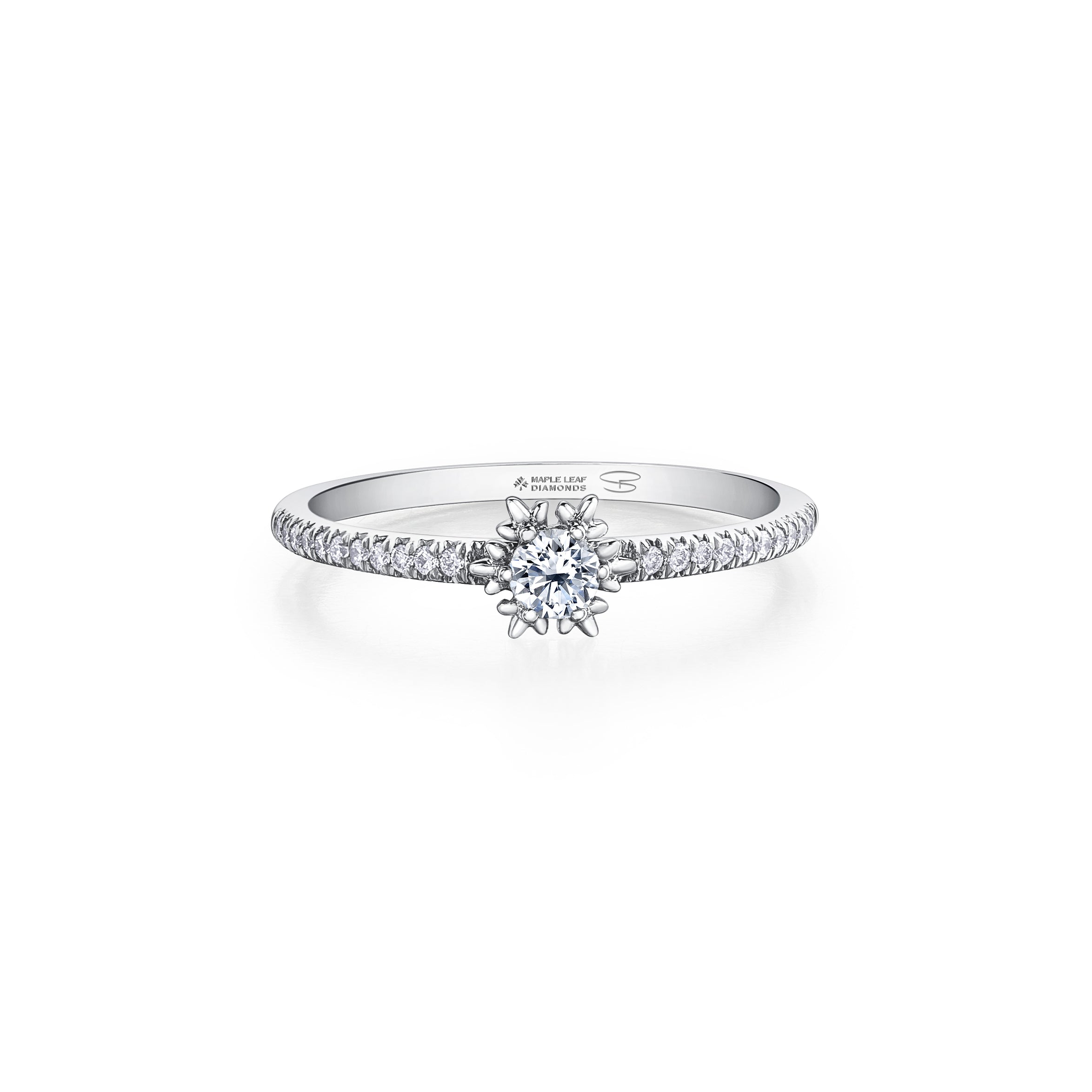 Crafted in 14KT white Certified Canadian Gold, this ring features a snowflake set with a round brilliant-cut Canadian diamond on a diamond set band.
