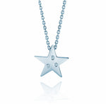 Crafted in 14KT white gold, this star shaped pendant is set with 3 round brilliant-cut diamonds.