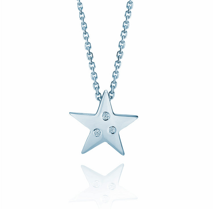 Crafted in 14KT white gold, this star shaped pendant is set with 3 round brilliant-cut diamonds.