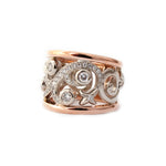 Crafted in 14KT white and rose gold, this ring features a diamond-set vine design with fleur de lys.