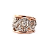 Crafted in 14KT white and rose gold, this ring features a diamond-set vine design with fleur de lys. 