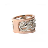 Crafted in 14KT white and rose gold, this ring features a diamond-set vine design with fleur de lys.