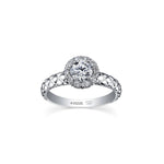 Crafted in 18kt Pure White™, this engagement ring features a melee diamond fur-trim halo with a round brilliant-cut Canadian centre diamond on a quilted band.