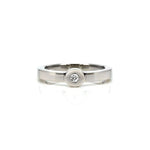 Crafted in 14KT white gold, this ring features a bezel set round brilliant-cut diamond and a flat band.