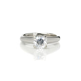 Crafted in 14KT white gold, this ring features a round-cut diamond in the classic four-prong setting.