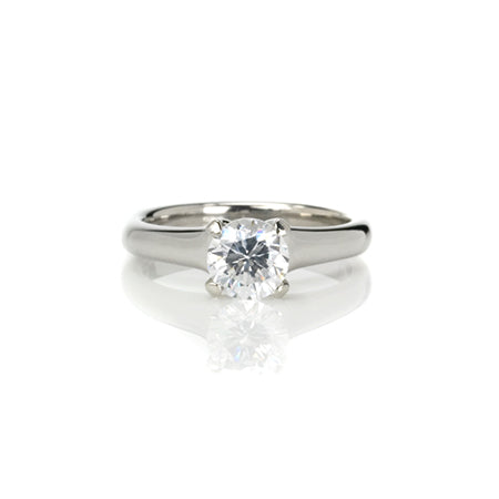 Crafted in 14KT white gold, this ring features a round-cut diamond in the classic four-prong setting.