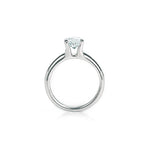 Crafted in 14KT white gold, this ring features a round-cut diamond in the classic four-prong setting.