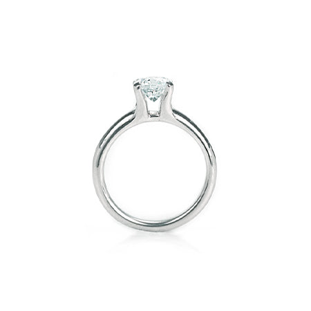Crafted in 14KT white gold, this ring features a round-cut diamond in the classic four-prong setting.