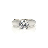 Crafted in 14KT white gold, this ring features a round-cut diamond in a half-bezel setting.