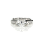 Crafted in 14KT white gold, this ring features a half-bezel set marquise-cut diamond horizontally on the band.