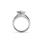 Crafted in 14KT white gold, this ring features a bezel set princess-cut diamond.