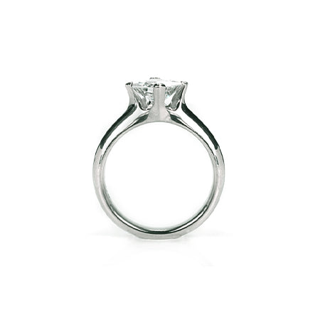 Crafted in 14KT white gold, this ring features a princess-cut diamond in a diagonal prong setting.