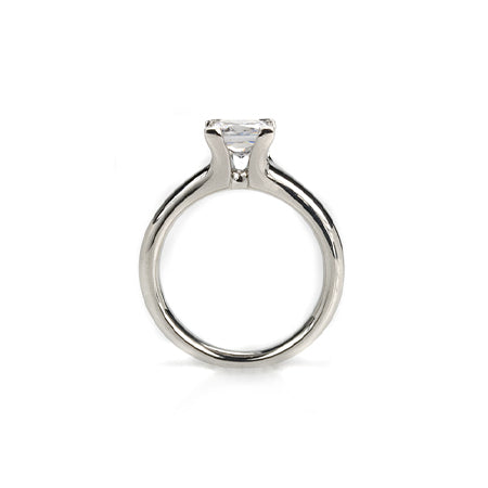 Crafted in 14KT white gold, this ring features a princess-cut diamond with v-shaped prongs holding it in place.