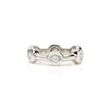 Crafted in 14KT white gold, this ring features six round brilliant-cut diamonds spaced apart in bezel settings.