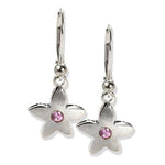 Crafted in 14KT white gold, these drop earrings each feature a flower  with a pink sapphire centre.