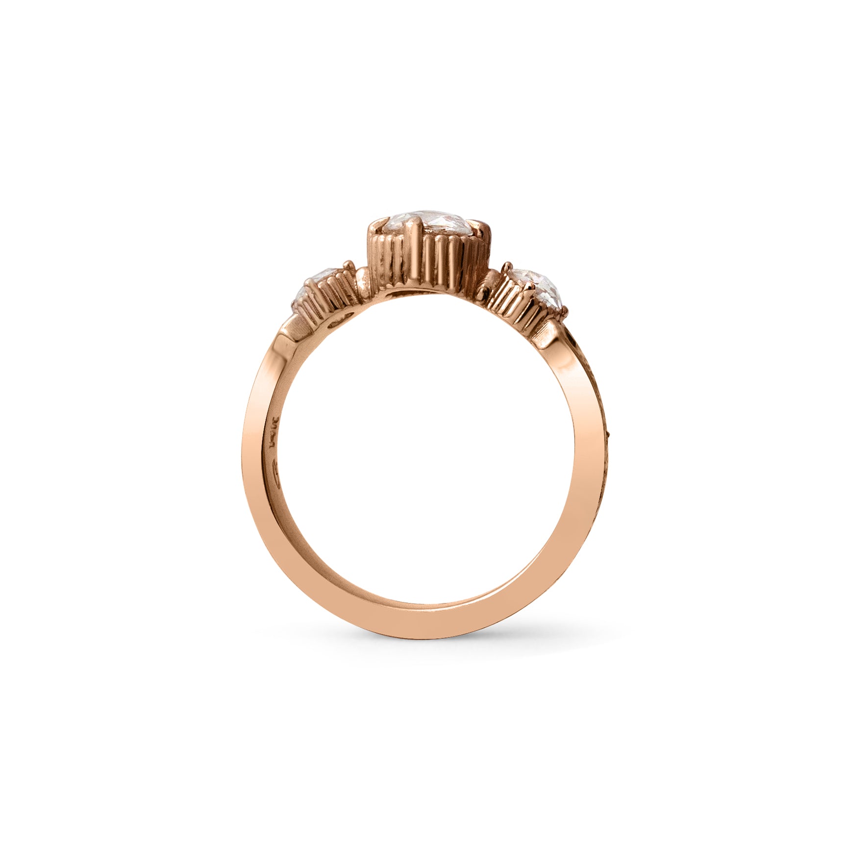 Crafted in 14KT rose gold, this ring features a large rose-cut diamond with a smaller diamond and a blue sapphire on each side. All on a vintage-inspired hand engraved band.