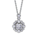 Crafted in 14KT white Certified Canadian Gold, this pendant features a diamond-set snowflake halo with a princess-cut Canadian centre diamond and a diamond-set bail.