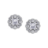 Crafted in 18KT white Certified Canadian Gold, these stud earrings feature diamond-set snowflake halos with princess-cut Canadian diamonds.