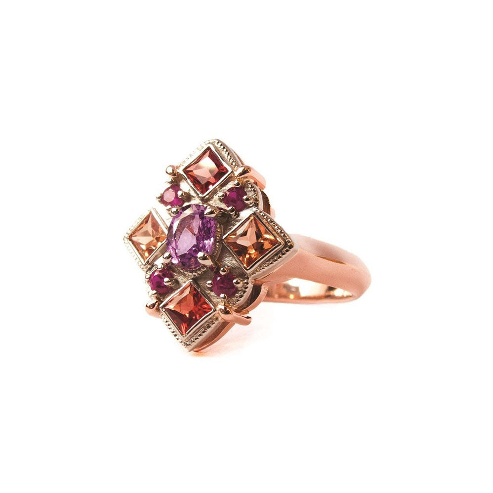 Crafted in 14KT rose and yellow gold, this ring features round, oval and square colourful sapphires set in a diamond shape.