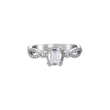 Crafted in 18kt Pure White™, this engagement ring features an emerald-cut Canadian centre diamond on a diamond set infinity symbol-inspired band.