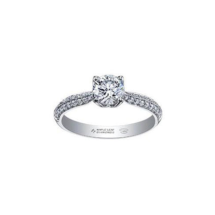 Crafted in 18kt Pure White™, this engagement ring features a round brilliant-cut Canadian diamond cradled by 4-petal water lily flower on a diamond set band.
