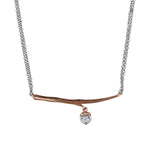 Crafted in 14KT rose Canadian Certified Gold, this necklace features a branch with an acorn charm set with a round brilliant-cut Canadian diamond.