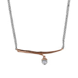 Crafted in 14KT rose Canadian Certified Gold, this necklace features a branch with an acorn charm set with a round brilliant-cut Canadian diamond.