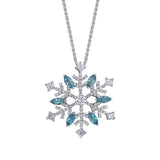 Crafted in 14KT white Certified Canadian Gold, this pendant features a snowflake set with blue topaz and round brilliant-cut Canadian diamonds.