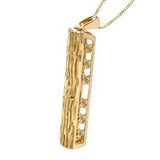 Crafted in 14KT yellow Canadian Certified Gold, this necklace features a tree bark-inspired pendant with a heart-shaped cut out filled with a round brilliant-cut Canadian diamond.