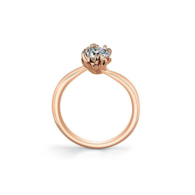 Crafted in 14KT rose Certified Canadian Gold, this ring features two maple leafs cradling a round brilliant-cut Canadian diamond.