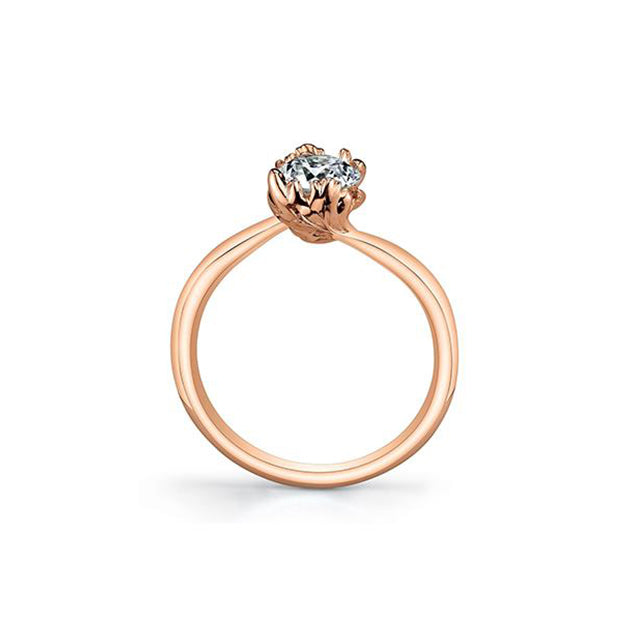 Crafted in 14KT rose Certified Canadian Gold, this ring features two maple leafs cradling a round brilliant-cut Canadian diamond. 