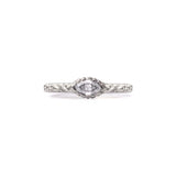 Crafted in 14KT brushed white gold, this ring features a bezel-set marquise-cut diamond on a quilted band.