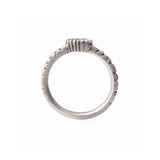 Crafted in 14KT brushed white gold, this ring features a bezel-set marquise-cut diamond on a quilted band.