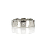 Crafted in 14KT white gold, this men’s band features six raised sections, each set with a princess-cut diamond. Alternating with hand-engraved orange blossoms in square settings.