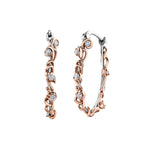 Crafted in 14KT white Certified Canadian Gold, these hoops earrings are wrapped with 14KT rose Certified Canadian Gold ivy vines set with round brilliant-cut Canadian diamonds