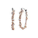 Crafted in 14KT white Certified Canadian Gold, these hoops earrings are wrapped with 14KT rose Certified Canadian Gold ivy vines set with round brilliant-cut Canadian diamonds